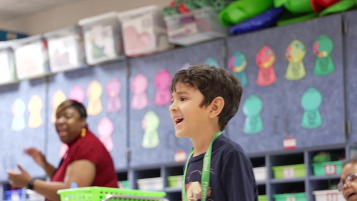 A student dances along to a song in Mr. LeGrande's kindergarten class at Florence Elementary