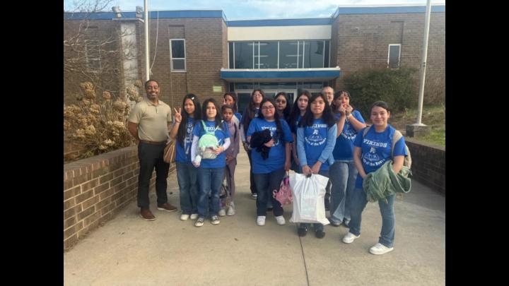 Students pose for a picture outside of Allen Middle School
