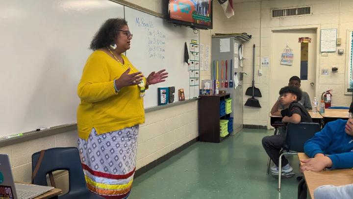 Allen Middle School teacher in front of students in a classroom